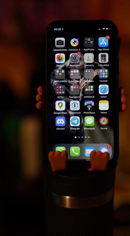 手机屏幕上并排显示 tubatool.com.cn ​ App 的首页导航卡片，橙色分类标签在米白背景上排成两列，光线柔和